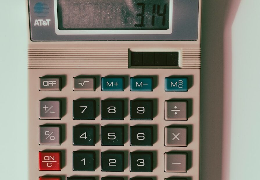 a calculator sitting on top of a white table